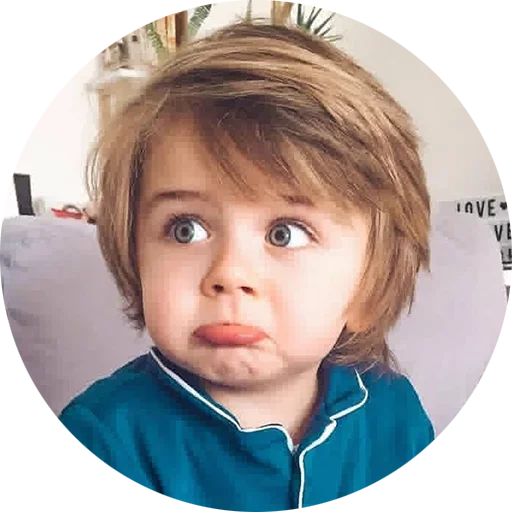 a young boy with a surprised look on his face